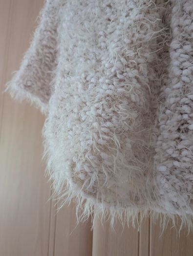 Hand knitted poncho