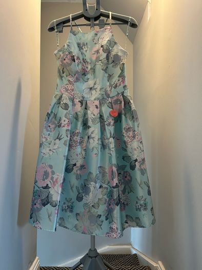 Chi Chi dress in size 16. New never worn . Pretty dress to wear on Weddings or any special occasion .