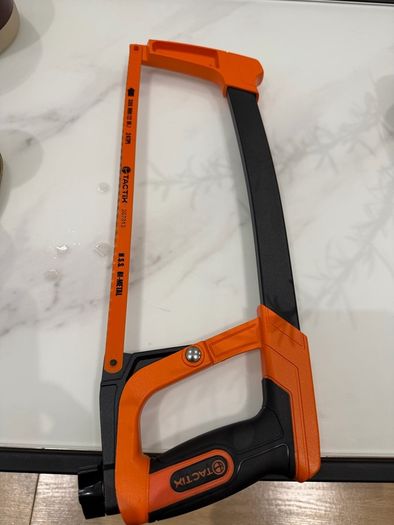 Tactix 300mm (12-inch) high-tension hacksaw with an orange and black frame