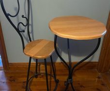 Wrought iron ornate table and chair