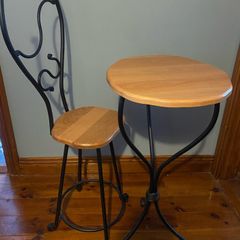 Wrought iron ornate table and chair