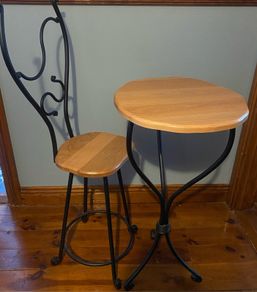 Wrought iron ornate table and chair