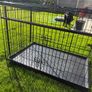 XL dog crate opens up by sliding doors at front and side. Read caption Image 5