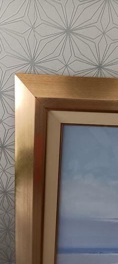 Two gold frame pictures with boats