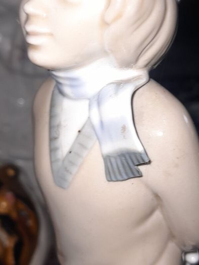 Old Ornament of a Boy in a Winter Hat and Light Colored Clothing on Skis, Made in Spain.