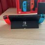Nintendo Switch OLED (Neon Blue/Red) + Mario Kart 8 Deluxe + Super Mario Bros. W Image 2