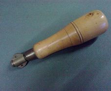 Old boxwood and brass tool pad with tools