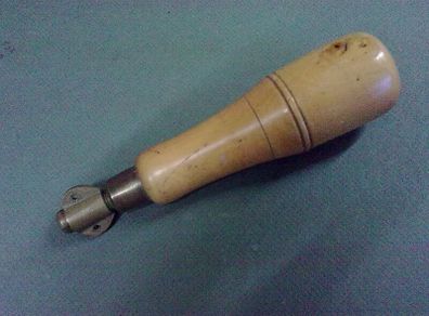 Old boxwood and brass tool pad with tools
