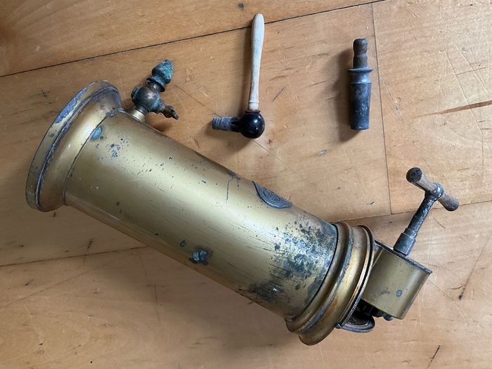 This is an antique  Dr. Eguisier brass irrigator, a medical instrument patented in 1843.
