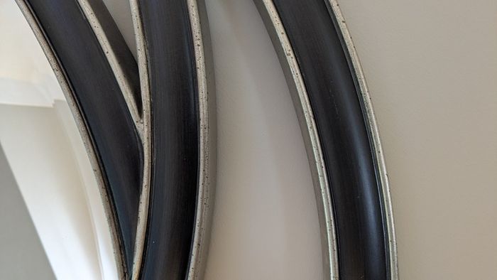 Contemporary circular wall mirror - black and silver finish