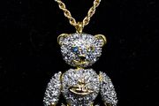 Vivienne Westwood teddy bear necklace on gold coloured chain.