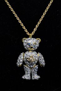 Vivienne Westwood teddy bear necklace on gold coloured chain.