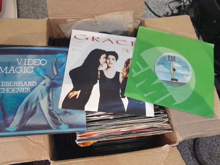 a box of 7" singles. 45 rpm vinyl records.