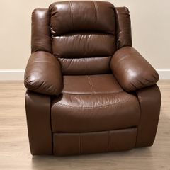 Brown leather recliner armchair