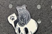 Cute cat and skull enamel pin