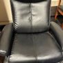 Pair of leather style armchairs with matching footstools Image 2