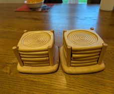 2 sets of wooden coasters