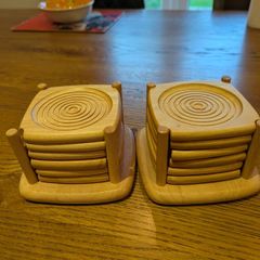 2 sets of wooden coasters