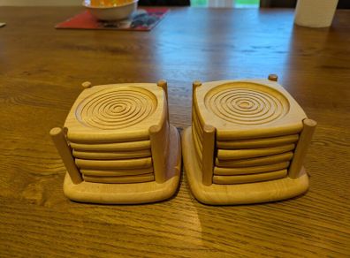 2 sets of wooden coasters
