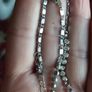 Beautiful necklace in silver tone with pink crystals in the form of flowers. Image 3