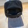 Black back pack, 3 pockets and a side net Image 3
