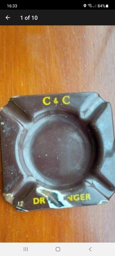 C & C Dry Ginger "ale" enamel metal ashtray ,dark brown,  very old vintage advertising ashtray, hard to come by ,collectors item,used condition  see pictures