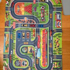 three toy cars playing mats