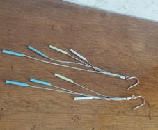 Silver tone chain earrings.