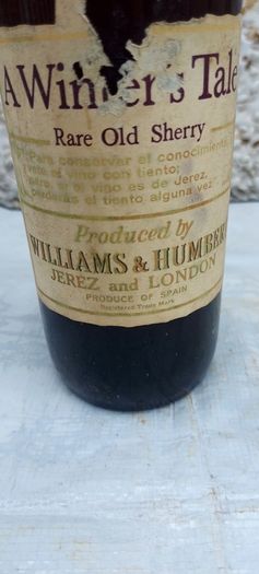 vintage bottle of winters tale sherry 3/4 full ,found in a old pub closed down,