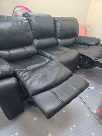 Black leather recliner sofa