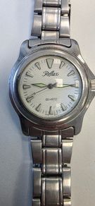 Silver-toned Reflex Quartz wristwatch with a white wave-patterned dial