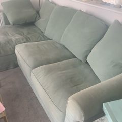 Corner sofa incorporating guest single bed and storage