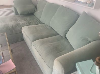Corner sofa incorporating guest single bed and storage
