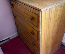 4 drawer chest of drawers with wood effect finish and original handles.