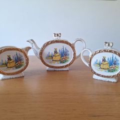 Tea pot, creamer and sugar bowl