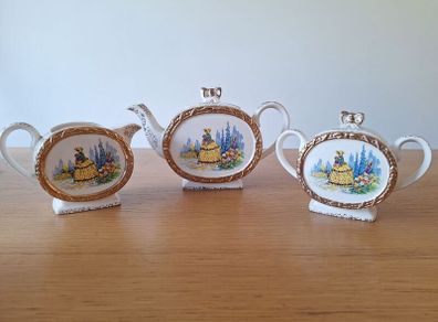 Tea pot, creamer and sugar bowl