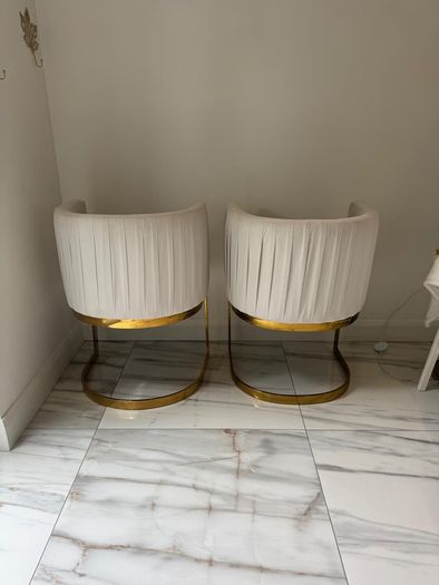 Cream and gold armchairs