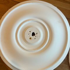Pair of decorative white ceiling roses for chandeliers or pendant lights.