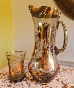 Gold painted glass Pitcher and glass.