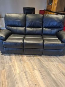 Black leather reclining couch