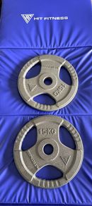 Two 15kg unused weights (like new)