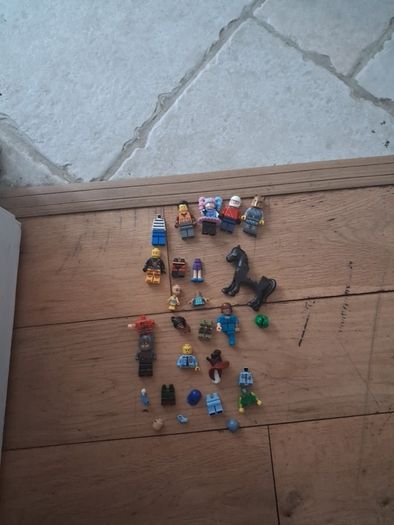 Big box of lego with mini figurines open to offers