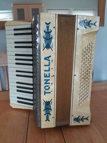 Vintage 1950's Tonella 34-Key/80-Bass Piano Accordion. With Case, Music books and sheet music.