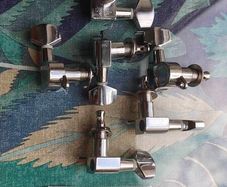 Electric guitar tuners with screw ear