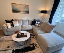 Comfortable L- shaped grey sofa