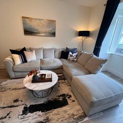 Comfortable L- shaped grey sofa