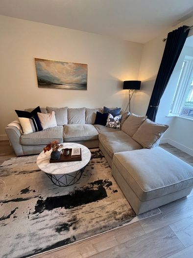 Comfortable L- shaped grey sofa