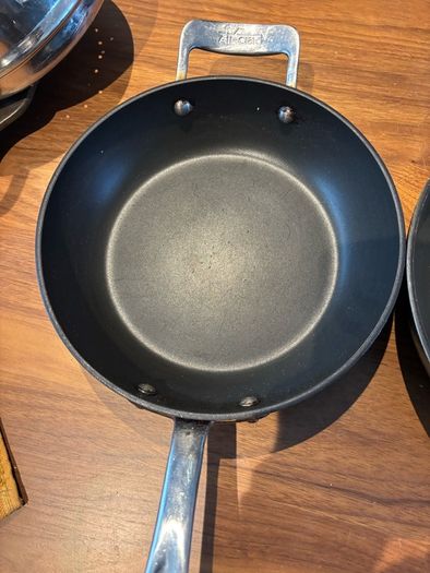 Set of All Clad pots and pans
