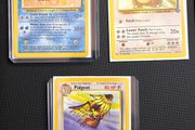 Lot of 21 original vintage Wizards of the Coast (WOTC) English Pokemon TCG cards from the 1999 Jungle and Base Set expansions.