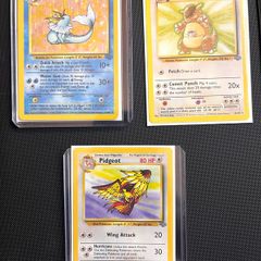 Lot of 21 original vintage Wizards of the Coast (WOTC) English Pokemon TCG cards from the 1999 Jungle and Base Set expansions.